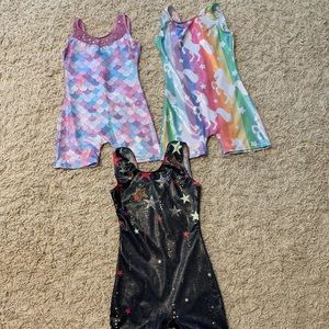 SOLD:  Three girls gymnastics leotards (5/6 and 7/8 sizes)